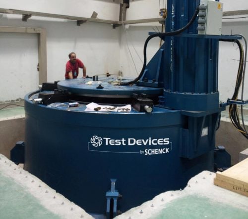 Man operating Test Devices by SCHENCK spin testing machine