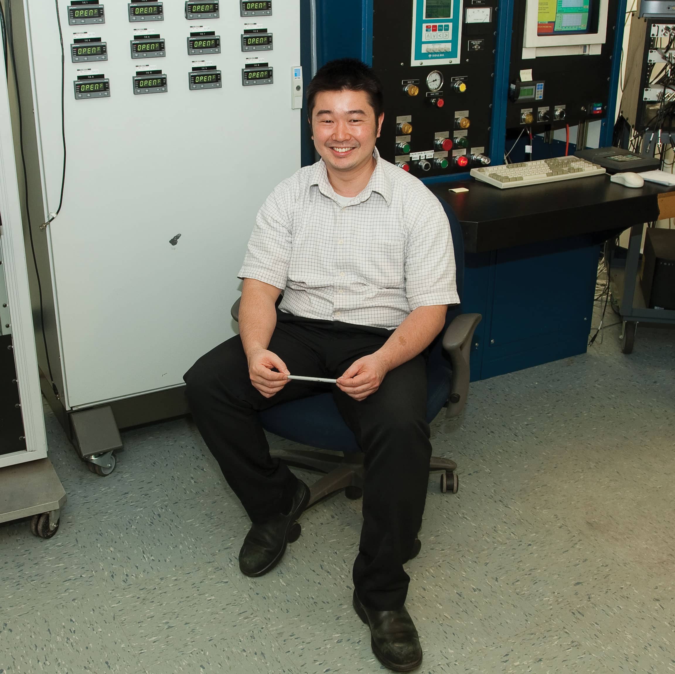 Smiling engineer in spin testing office