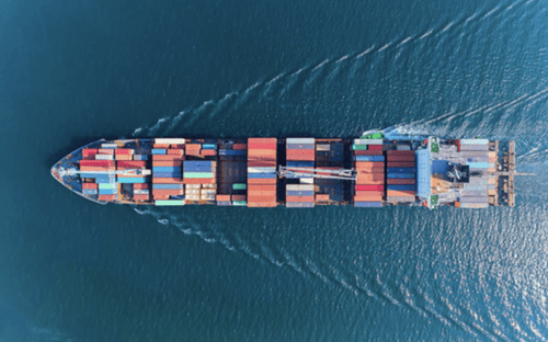 Overhead on shipping barge moving through water