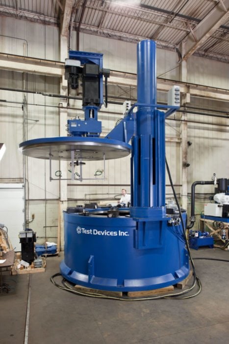 Blue Test Devices Inc. spin pit with operator in background